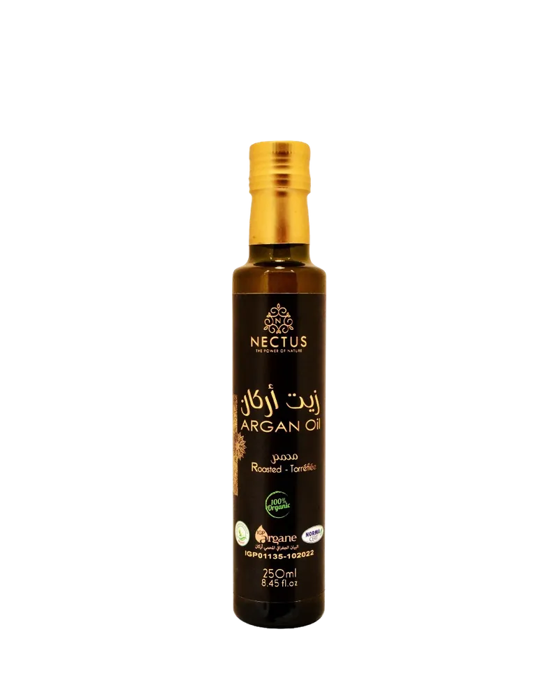 Bouteille d’huile d’argan torréfiée alimentaire NECTUS, huile ambrée pour finition à cru.
