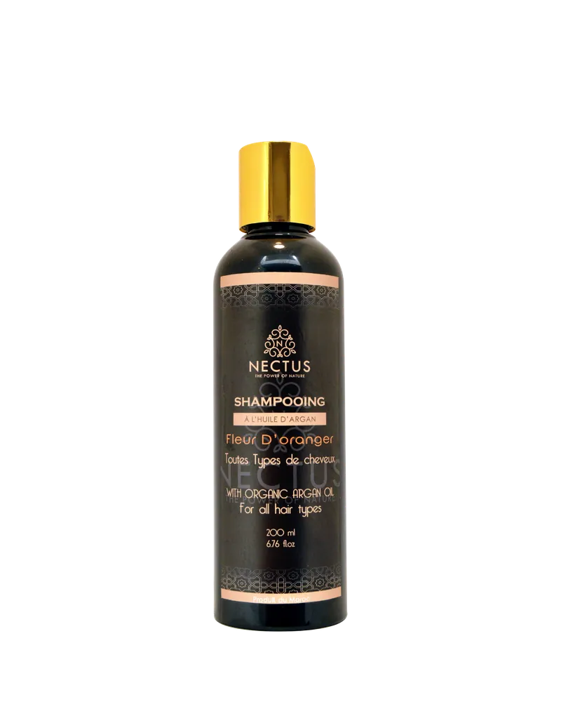 Flacon de shampoing NECTUS Argan & Fleur d’Oranger, soin doux pour tous types de cheveux.